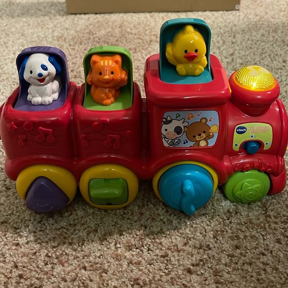 Vtech roll and surprise animal train